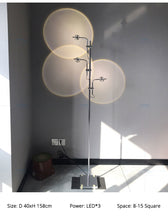 Load image into Gallery viewer, Minimalist creative LED light and shadow floor lamp living room sofa lamp Italian art projection sunset designer floor lamp

